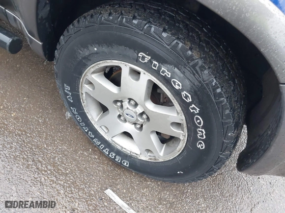 2005 Ford Escape XLT with VIN 1FMYU931X5KA28279, listed as a IAAI auction lot 41861060 with 173,999 mi miles. Bid and sale history available at carsss.com. Image 12.