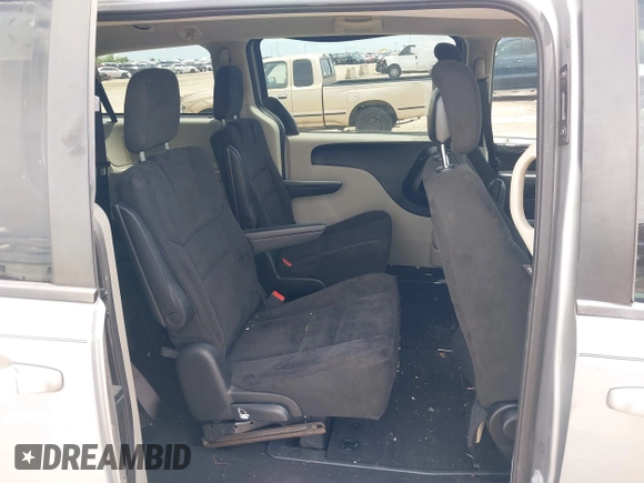 2015 Dodge Grand Caravan American Value with VIN 2C4RDGBGXFR542672, listed as a IAAI auction lot 42230608 with 102,753 mi miles and . Bid and sale history available at DreamBid. Image 8.