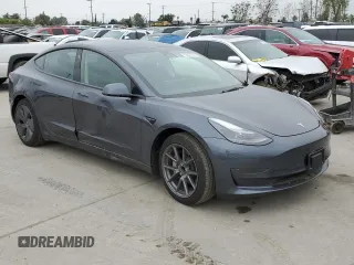 2023 Tesla Model 3 with VIN 5YJ3E1EA3PF697049, listed as a Copart auction lot 55601295 with 12,373 mi miles and Salvage Title. Bid and sale history available at DreamBid. Image 4.