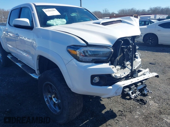 2021 Toyota Tacoma 4WD SR5 with VIN 3TYDZ5BN4MT000619, listed as a IAAI auction lot 41886686 with 91,338 mi miles. Bid and sale history available at carsss.com. Image 6.