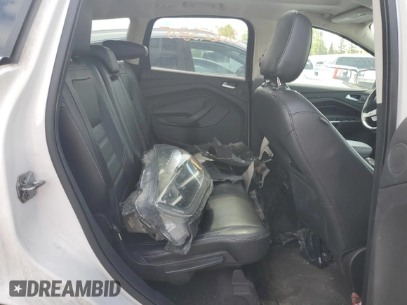 2018 Ford Escape Titanium z VIN 1FMCU9J94JUD09141, wystawiony jako Copart lot #56625805 z przebiegiem Nie podano mil oraz Szkoda całkowita • Salvage title. Historia ofert i sprzedaży dostępna na DreamBid. Obrazek 11.