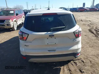 2017 Ford Escape SE z VIN 1FMCU9GD6HUB41900, wystawiony jako IAAI lot #41689153 z przebiegiem 85 975 mil mil oraz . Historia ofert i sprzedaży dostępna na DreamBid. Obrazek 16.