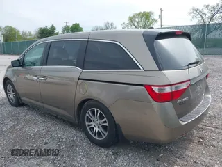 2013 Honda Odyssey EX-L with VIN 5FNRL5H65DB064238, listed as a IAAI auction lot 42050743 with 189,437 mi miles and . Bid and sale history available at carsss.com. Image 3.