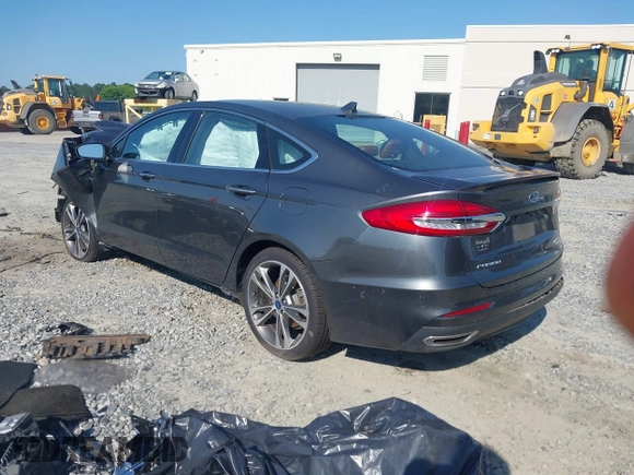 2020 Ford Fusion Titanium with VIN 3FA6P0K91LR175109, listed as a IAAI auction lot 42267532 with 75,000 mi miles and . Bid and sale history available at DreamBid. Image 3.