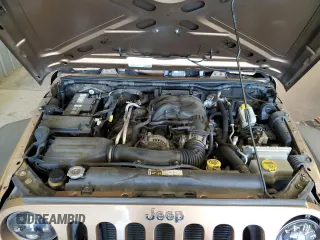 2015 Jeep Wrangler Unlimited Freedom with VIN 1C4BJWDG5FL713046, listed as a Copart auction lot 58563455 with 144,179 mi miles and Salvage title. Bid and sale history available at DreamBid. Image 12.