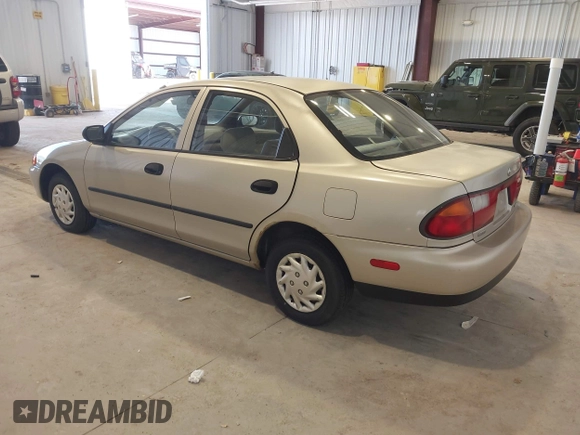 1997 Mazda Protege DX z VIN JM1BC1415V0133823, wystawiony jako IAAI lot #42091960 z przebiegiem 149 959 mil mil oraz . Historia ofert i sprzedaży dostępna na DreamBid. Obrazek 3.