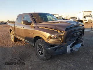 2017 Ram 1500 Rebel z VIN 1C6RR7YT0HS534465, wystawiony jako IAAI lot #41240431 z przebiegiem 125 886 mil mil oraz . Historia ofert i sprzedaży dostępna na DreamBid. Obrazek 1.