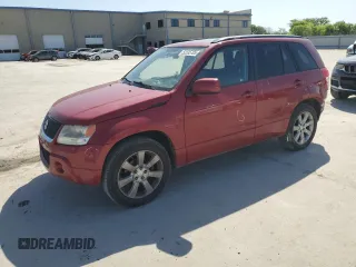2011 Suzuki Grand Vitara Limited z VIN JS3TE0D72B4100054, wystawiony jako Copart lot #52535705 z przebiegiem 131 468 mil mil oraz Szkoda całkowita • Salvage title. Historia ofert i sprzedaży dostępna na DreamBid. Obrazek 1.