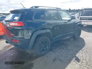 2015 Jeep Cherokee Trailhawk with VIN 1C4PJMBS7FW699392, listed as a IAAI auction lot 41797617 with 1 mi miles. Bid and sale history available at carsss.com. Image 4.