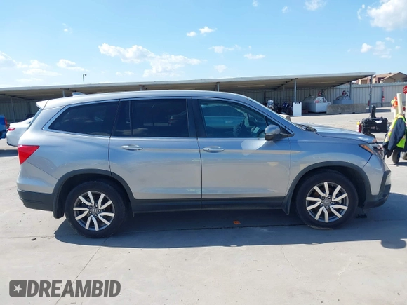 2020 Honda Pilot EX-L with VIN 5FNYF5H46LB004744, listed as a IAAI auction lot 42095298 with 76,159 mi miles and . Bid and sale history available at DreamBid. Image 12.