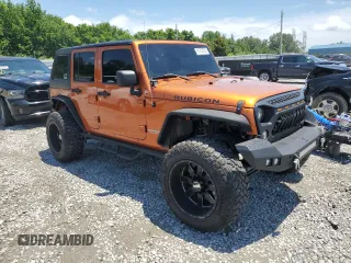 2011 Jeep Wrangler Unlimited Rubicon with VIN 1J4HA6H12BL584493, listed as a Copart auction lot 61765735 with 151,175 mi miles and Salvage title. Bid and sale history available at DreamBid. Image 4.