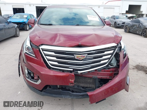 2017 Cadillac XT5 FWD with VIN 1GYKNARS2HZ107587, listed as a IAAI auction lot 41614842 with 124,611 mi miles and . Bid and sale history available at carsss.com. Image 12.