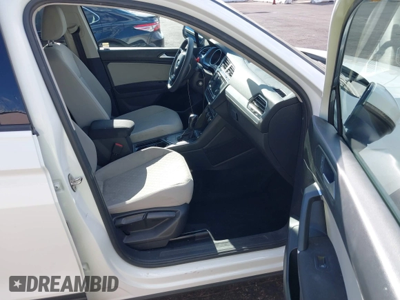 2020 Volkswagen Tiguan S with VIN 3VV1B7AXXLM036994, listed as a IAAI auction lot 42643035 with 62,676 mi miles and . Bid and sale history available at DreamBid. Image 5.