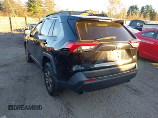 2023 Toyota RAV4 Hybrid XLE with VIN 2T3UWRFV1PW185916, listed as a IAAI auction lot 40877774 with 88,564 mi miles. Bid and sale history available at carsss.com. Image 3.
