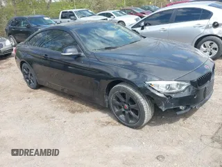 2015 BMW 4 Series 428i xDrive with VIN WBA3N5C56FK620915, listed as a IAAI auction lot 42023624 with 112,309 mi miles. Bid and sale history available at carsss.com. Image 1.