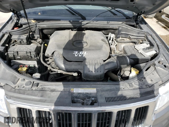 2012 Jeep Grand Cherokee Laredo with VIN 1C4RJEAG1CC306950, listed as a Copart auction lot 84912434 with 128,659 mi miles and Salvage Title. Bid and sale history available at carsss.com. Image 12.