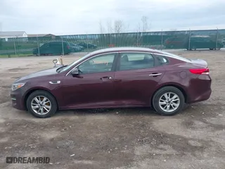 2016 Kia Optima LX with VIN 5XXGT4L36GG108599, listed as a IAAI auction lot 42065639 with 127,387 mi miles. Bid and sale history available at carsss.com. Image 14.