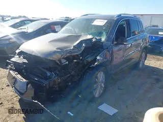 2011 Volkswagen Tiguan SE with VIN WVGBV7AX7BW538690, listed as a IAAI auction lot 41338881 with Not Provided miles and . Bid and sale history available at DreamBid. Image 2.