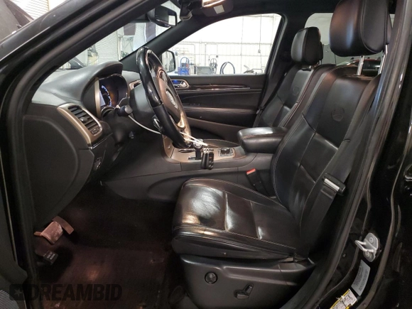 2015 Jeep Grand Cherokee Overland with VIN 1C4RJFCG7FC911899, listed as a Copart auction lot 54123925 with 243,031 mi miles and Salvage Title. Bid and sale history available at carsss.com. Image 7.