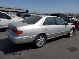 2000 Toyota Camry LE z VIN JT2BF28K5Y0261315, wystawiony jako Copart lot #59607935 z przebiegiem 87 184 mil mil oraz Szkoda całkowita • Salvage title. Historia ofert i sprzedaży dostępna na DreamBid. Obrazek 3.