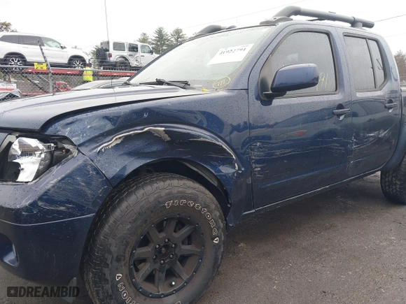 2011 Nissan Frontier PRO-4X with VIN 1N6AD0EV8BC435649, listed as a IAAI auction lot 41922791 with 203,928 mi miles. Bid and sale history available at carsss.com. Image 6.