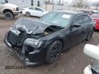 2015 Chrysler 300 with VIN 2C3CCAGGXFH831351, listed as a IAAI auction lot 41721941 with 106,577 mi miles. Bid and sale history available at carsss.com. Image 2.
