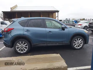 2015 Mazda CX-5 Grand Touring with VIN JM3KE4DY0F0493969, listed as a IAAI auction lot 41581885 with 71,014 mi miles. Bid and sale history available at carsss.com. Image 14.