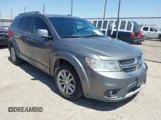 2013 Dodge Journey SXT with VIN 3C4PDCBB4DT563709, listed as a IAAI auction lot 42019033 with 201,188 mi miles. Bid and sale history available at carsss.com. Image 1.