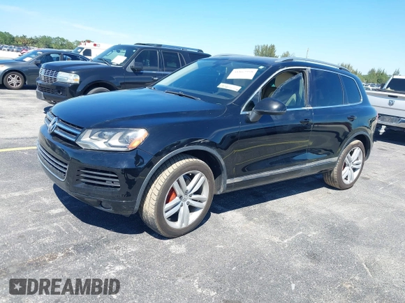 2013 Volkswagen Touareg Lux with VIN WVGEF9BP6DD004454, listed as a IAAI auction lot 41862958 with 239,548 mi miles and . Bid and sale history available at DreamBid. Image 17.