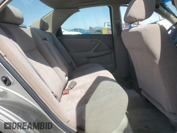 2001 Toyota Camry CE z VIN JT2BG22K410568101, wystawiony jako Copart lot #57184125 z przebiegiem Nie podano mil oraz Szkoda całkowita • Salvage title. Historia ofert i sprzedaży dostępna na DreamBid. Obrazek 10.