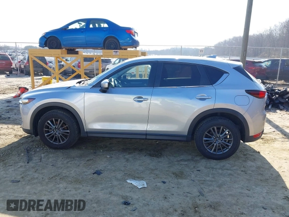 2020 Mazda CX-5 Touring with VIN JM3KFACM8L0727393, listed as a IAAI auction lot 41492627 with 91,521 mi miles. Bid and sale history available at carsss.com. Image 14.