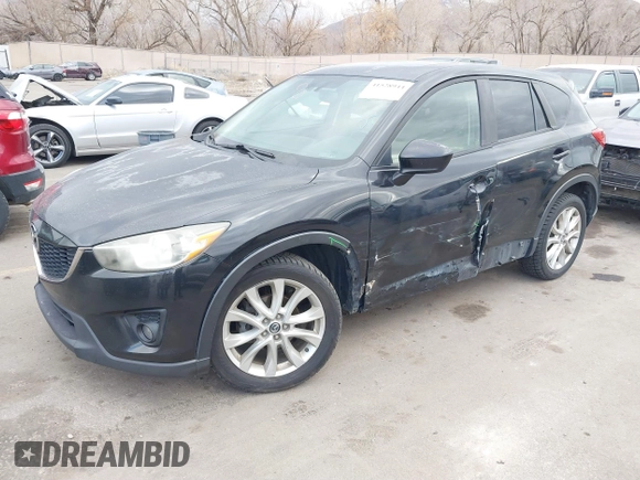 2013 Mazda CX-5 Grand Touring with VIN JM3KE4DEXD0154638, listed as a IAAI auction lot 41528944 with 195,159 mi miles. Bid and sale history available at carsss.com. Image 2.