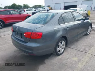 2014 Volkswagen Jetta TDI with VIN 3VWLL7AJ0EM386019, listed as a IAAI auction lot 42229260 with 122,858 mi miles and . Bid and sale history available at DreamBid. Image 4.