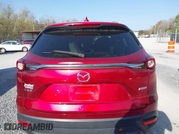 2019 Mazda CX-9 Touring with VIN JM3TCACY0K0310851, listed as a IAAI auction lot 42066395 with 91,046 mi miles and . Bid and sale history available at DreamBid. Image 17.