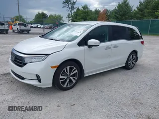 2023 Honda Odyssey Touring with VIN 5FNRL6H88PB079716, listed as a IAAI auction lot 42208628 with 26,679 mi miles and . Bid and sale history available at DreamBid. Image 2.