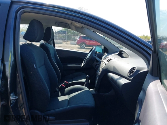 2009 Toyota Yaris with VIN JTDBT903194047784, listed as a IAAI auction lot 42049872 with 115,735 mi miles. Bid and sale history available at carsss.com. Image 5.