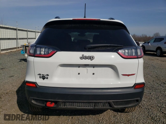 2022 Jeep Cherokee Trailhawk с VIN 1C4PJMBX3ND549057, выставлен на аукционе Copart как лот 48959915 с пробегом 21 381 миль миль и Списание • Salvage title. История ставок и продаж доступна на DreamBid. Изображение 6.