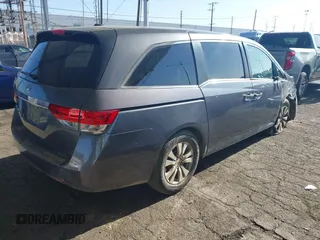 2014 Honda Odyssey EX-L with VIN 5FNRL5H61EB079742, listed as a IAAI auction lot 41992473 with 125,397 mi miles and . Bid and sale history available at carsss.com. Image 4.