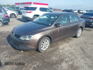 2011 Volkswagen Jetta Sedan SE w/Convenience & Sunroof with VIN 3VWDX7AJXBM329427, listed as a IAAI auction lot 42121116 with 193,490 mi miles. Bid and sale history available at carsss.com. Image 2.
