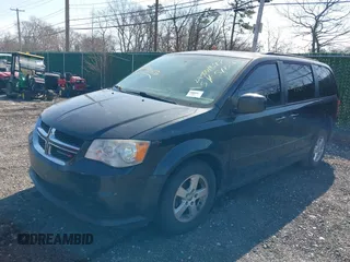 2013 Dodge Grand Caravan SXT with VIN 2C4RDGCG1DR626827, listed as a IAAI auction lot 38984754 with 224,487 mi miles and . Bid and sale history available at DreamBid. Image 2.