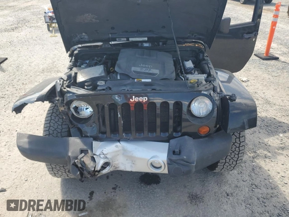 2012 Jeep Wrangler Unlimited Sahara with VIN 1C4HJWEG5CL205826, listed as a Copart auction lot 58222115 with 98,940 mi miles and Salvage title. Bid and sale history available at DreamBid. Image 12.