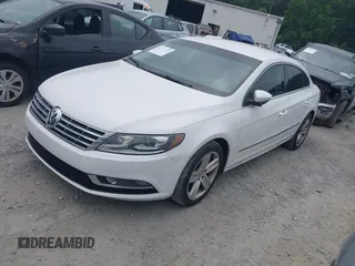 2014 Volkswagen CC R-Line with VIN WVWBP7AN7EE534565, listed as a IAAI auction lot 42477774 with 85,539 mi miles and . Bid and sale history available at DreamBid. Image 2.