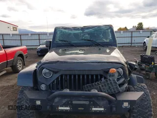 2014 Jeep Wrangler Sahara with VIN 1C4AJWBG5EL247812, listed as a IAAI auction lot 40909884 with 106,475 mi miles and . Bid and sale history available at DreamBid. Image 12.