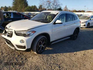 2018 BMW X1 xDrive28i with VIN WBXHT3C38J5L31384, listed as a Copart auction lot 66323172 with 74,272 mi miles. Bid and sale history available at carsss.com. Image 2.