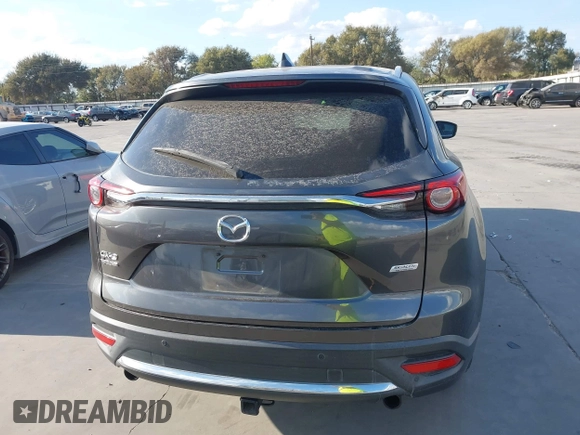 2016 Mazda CX-9 Grand Touring with VIN JM3TCADY8G0114940, listed as a IAAI auction lot 40701187 with 112,311 mi miles and . Bid and sale history available at DreamBid. Image 16.
