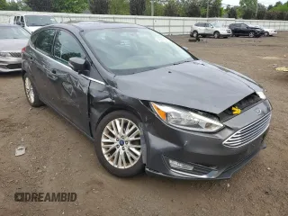 2017 Ford Focus Titanium z VIN 1FADP3N29HL240527, wystawiony jako Copart lot #62891695 z przebiegiem 126 926 mil mil oraz Szkoda całkowita • Salvage title. Historia ofert i sprzedaży dostępna na DreamBid. Obrazek 4.