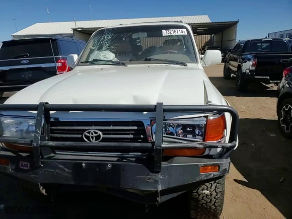 1997 Toyota Land Cruiser with VIN JT3HJ85J2V0180979, listed as a Copart auction lot 73216714 with 239,444 mi miles and Salvage Title. Bid and sale history available at carsss.com. Image 12.