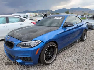2015 BMW 2 Series M235i with VIN WBA1J7C59FV253988, listed as a Copart auction lot 63465935 with 64,157 mi miles and Salvage title. Bid and sale history available at DreamBid. Image 1.