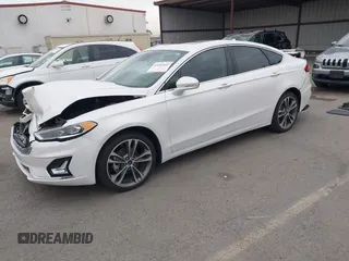 2020 Ford Fusion Titanium with VIN 3FA6P0K92LR103416, listed as a IAAI auction lot 41681810 with 54,902 mi miles and . Bid and sale history available at DreamBid. Image 2.