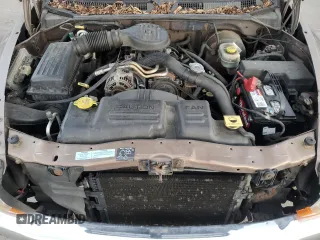 2001 Dodge Dakota z VIN 1B7GG2AX11S108005, wystawiony jako Copart lot #87124934 z przebiegiem 248 482 mil mil oraz Czysty tytuł • Clean title. Historia ofert i sprzedaży dostępna na DreamBid. Obrazek 11.